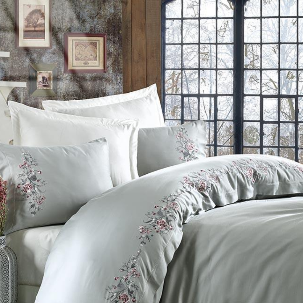 Romantic interior designed with maldive-blue color quilt cover and pillows on the bed
