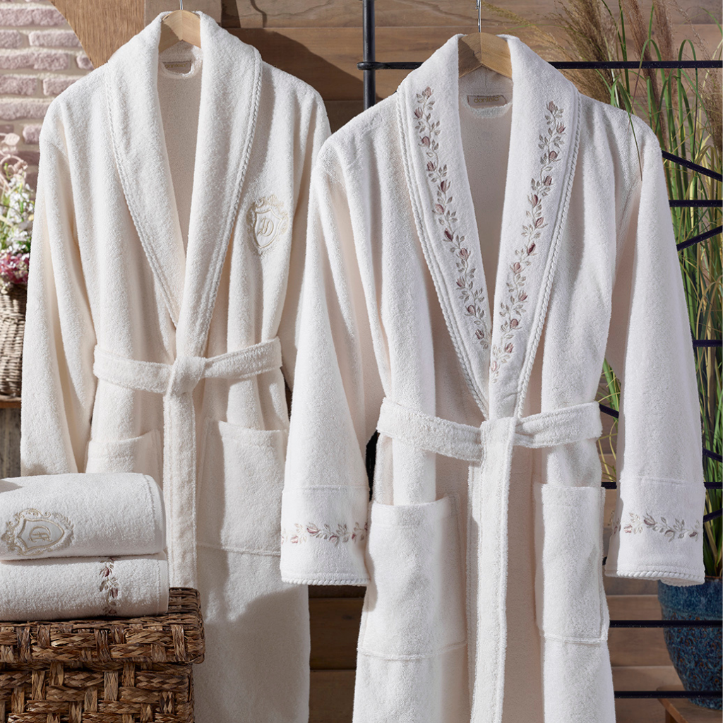 Cream-ecru bathrobe and bath towel set in a modern bathroom