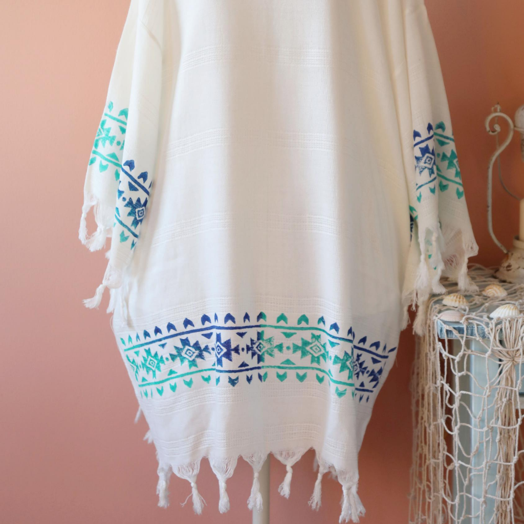 Turkish, beach-dress/ kimono which has hand-made prints and tassels at the borders