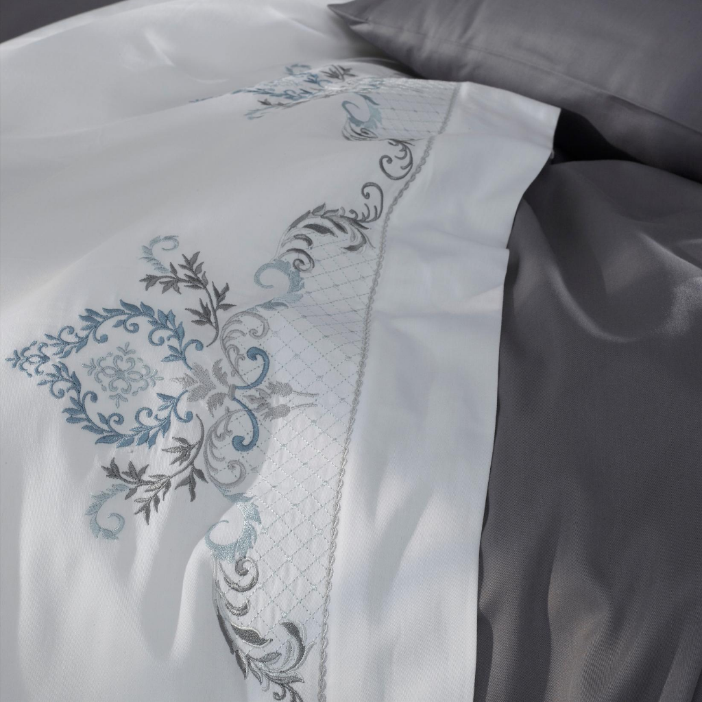 Duvet cover is crafted with royal blue and silver-grey, damask pattern embroideries