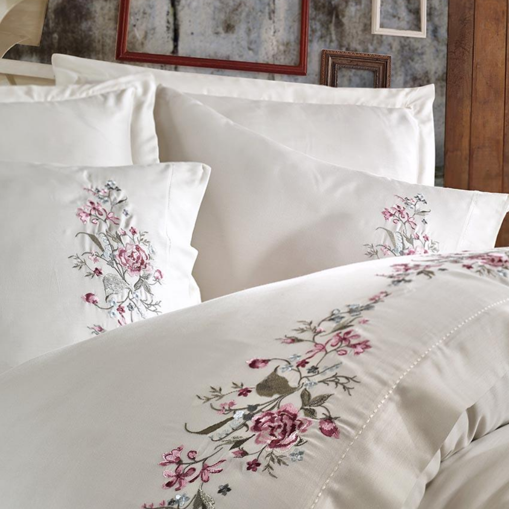Creme quilt cover and pillowcases are decorated with bordeaux and brown color floral emroideries