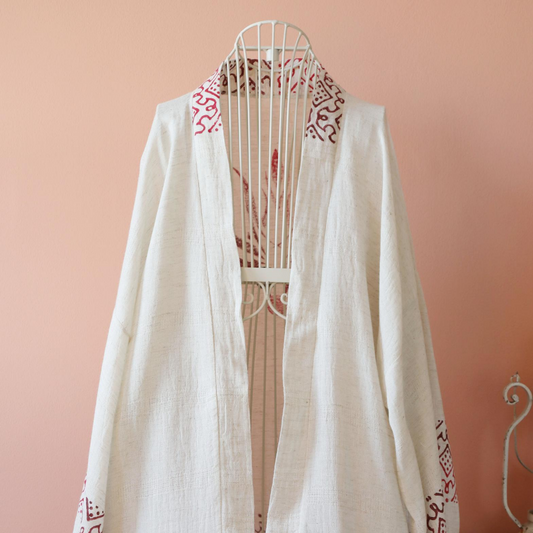 Hand-made linen kimono has red hand-made prints on collar and cuffs