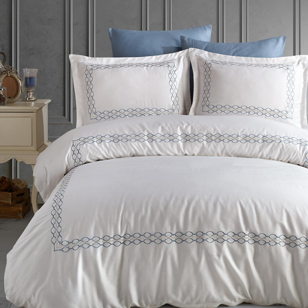 Luxurious bedroom interior designed with white-blue Turkish bed linen set
