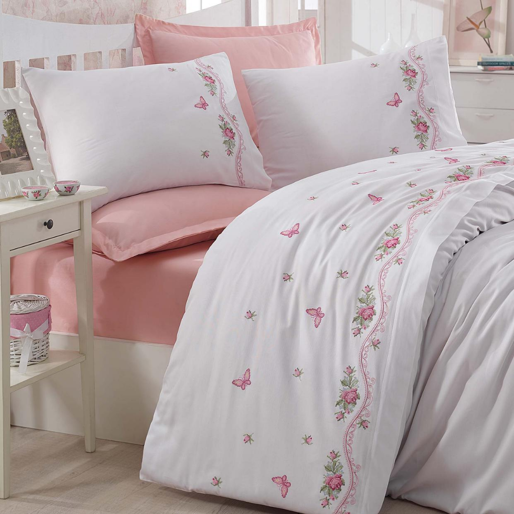 Cotton-sateen, white duvet cover and pink bed sheet, decorated with traditional Turkish cross-stitch technique 