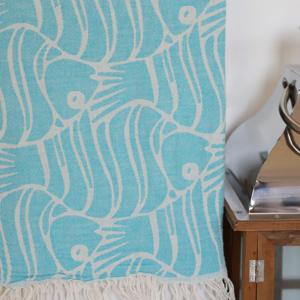 Blue, Turkish towel made of soft cotton has decorated with fish designs 