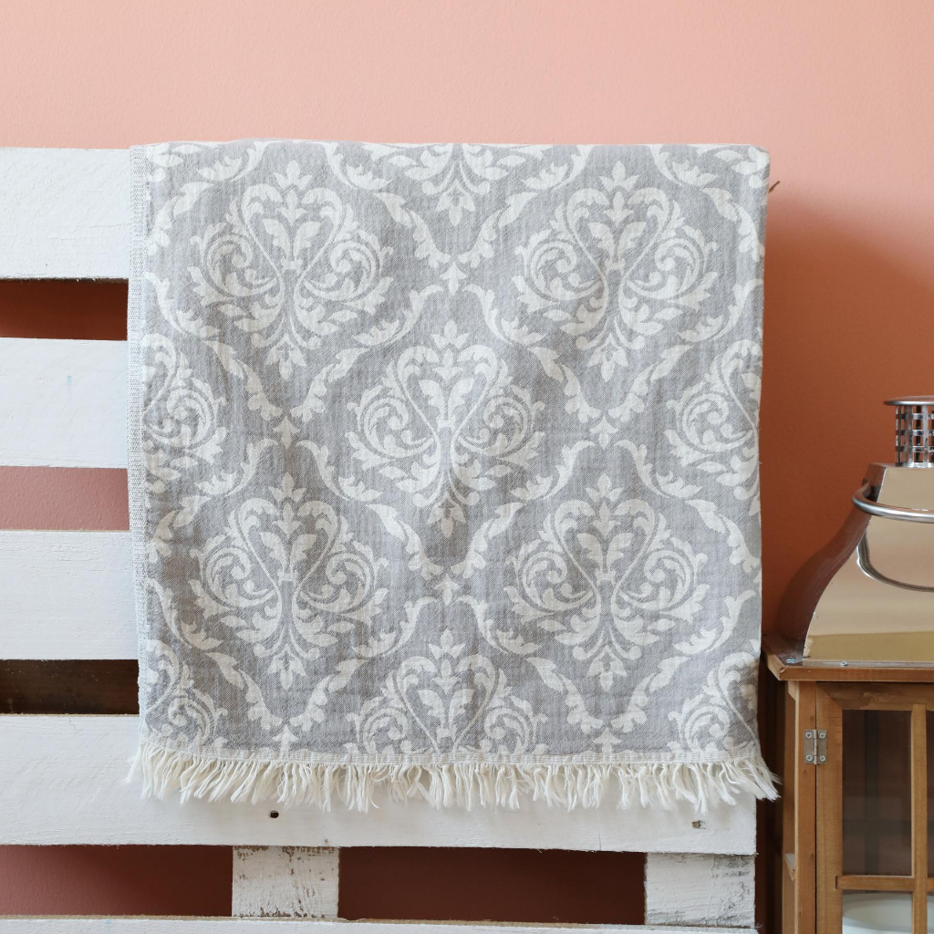Grey, cotton Beach towel has oriental designs