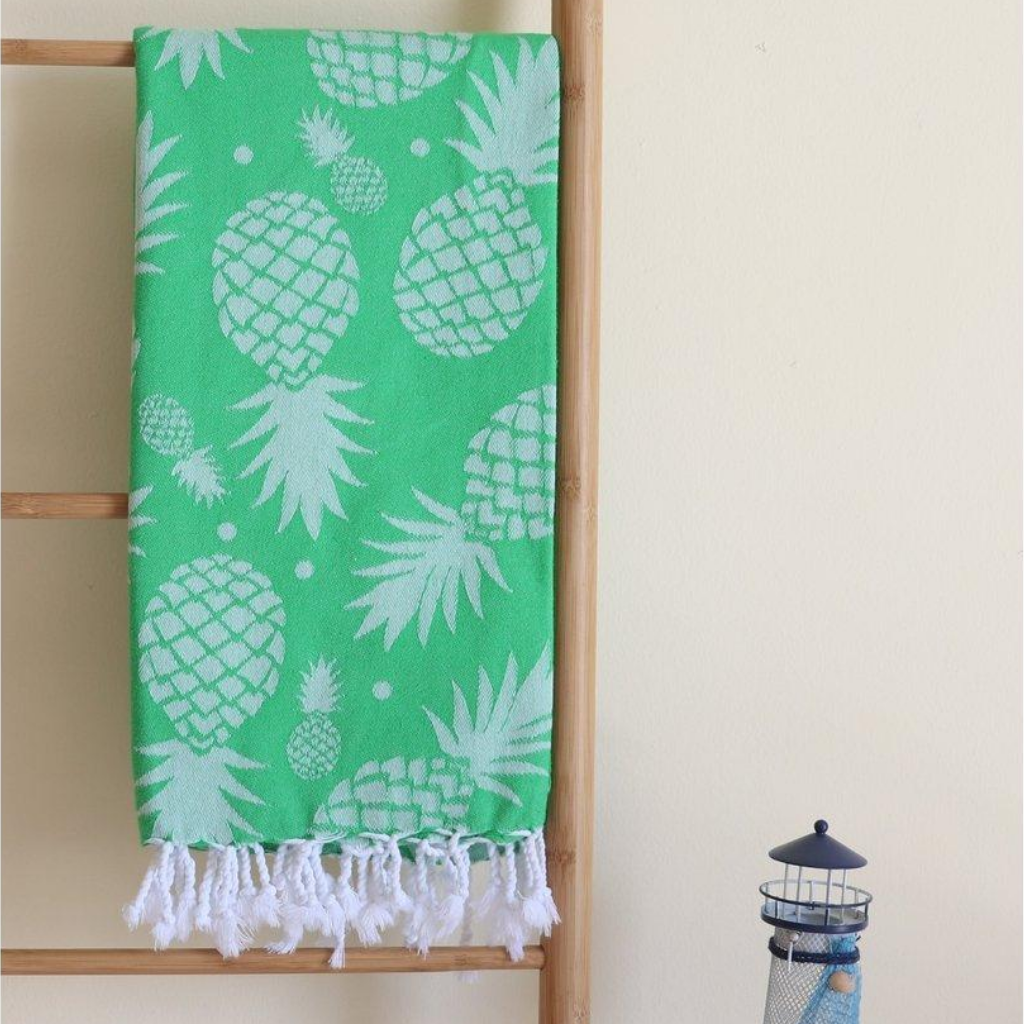 Green, pineapple Turkish beach/pool towel has tassels