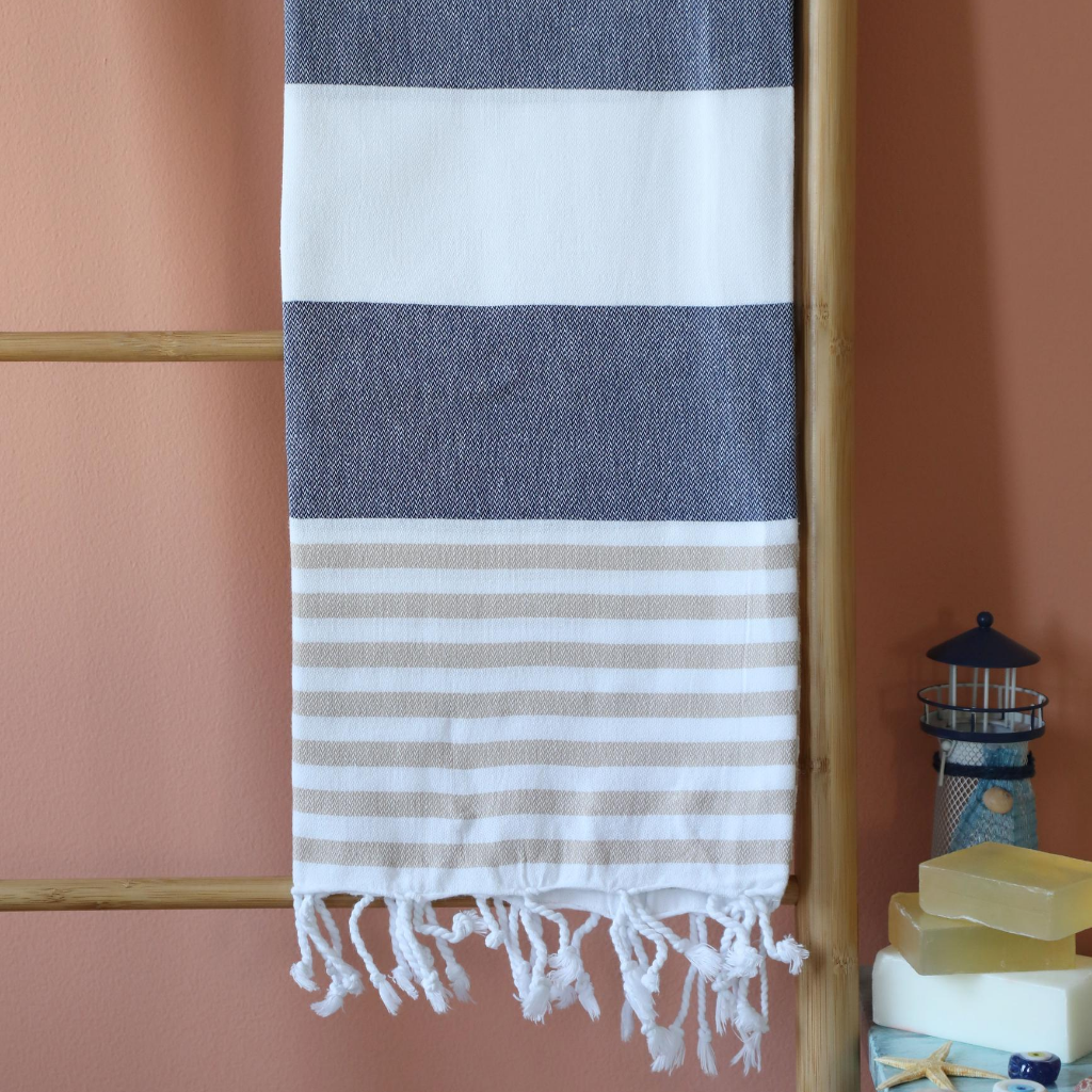 Peshtemal sailor beach towel has brown and navy stripes