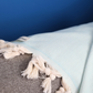 Cotton, turquoise blanket has herringbone design